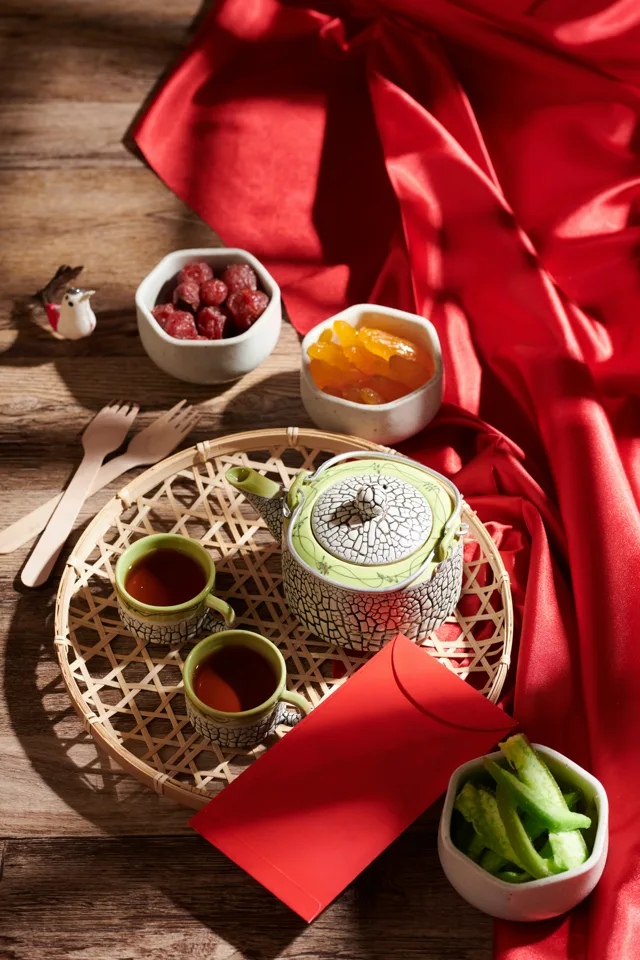 A festive Chinese gift and dining scene wrapped in red