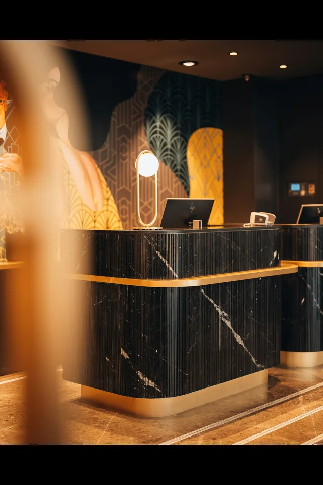 A hotel reception desk and lobby