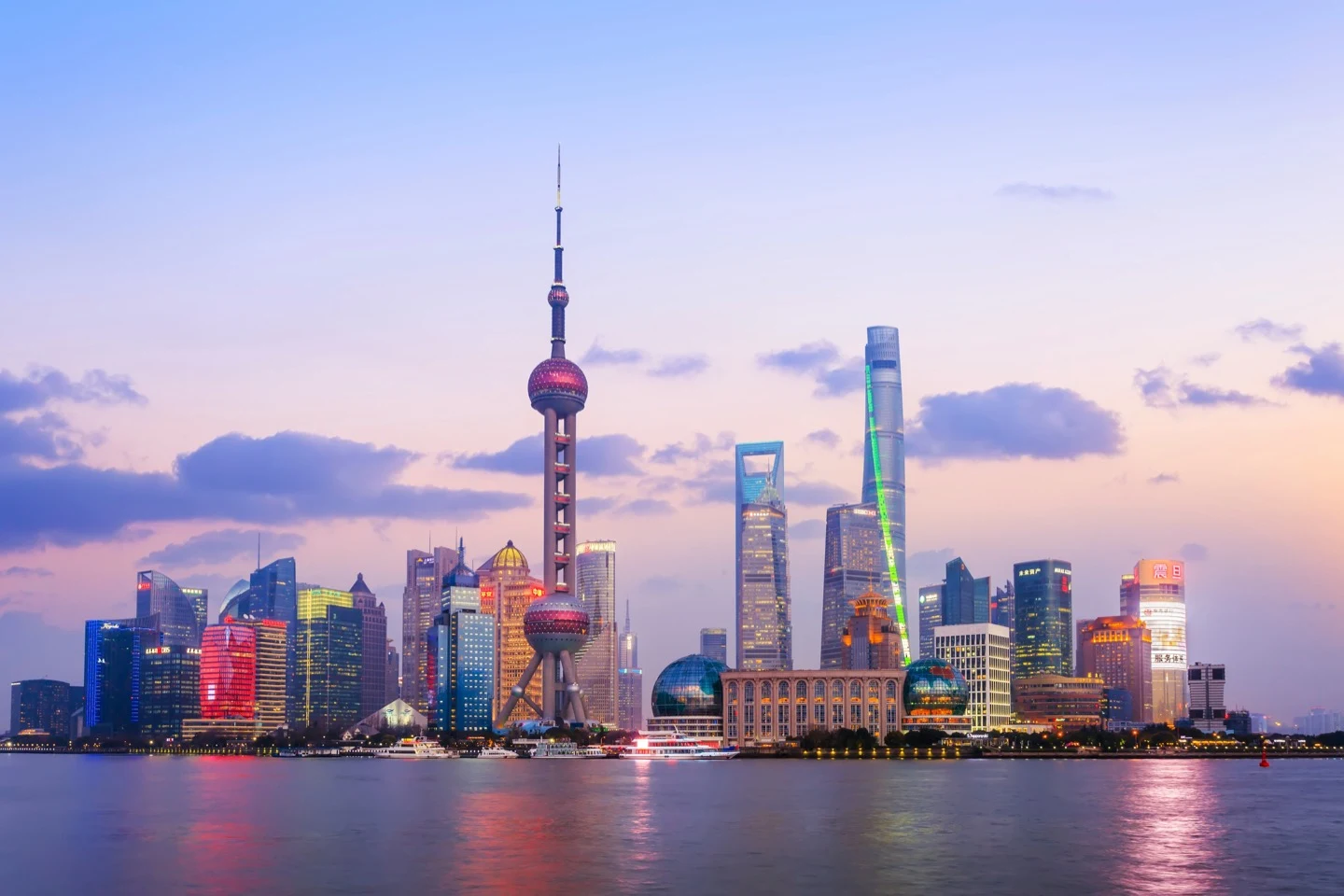 The Shanghai Lujiazui skyline featuring the Oriental Pearl Tower at dusk